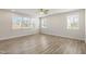 Bright living room with hardwood floors, large windows, and recessed lighting at 82 Gin Branch Rd, Wendell, NC 27591