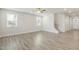 Spacious living room featuring hardwood floors, neutral walls, and a staircase at 82 Gin Branch Rd, Wendell, NC 27591