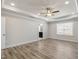 Main bedroom with hardwood floors, window, and ensuite bath at 82 Gin Branch Rd, Wendell, NC 27591
