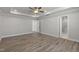 Main bedroom with hardwood floors and ensuite bathroom access at 82 Gin Branch Rd, Wendell, NC 27591
