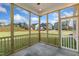 Screened porch overlooking backyard and neighborhood at 82 Gin Branch Rd, Wendell, NC 27591