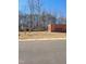 A residential lot ready for construction with trees and a shipping container in the background at 8713 Little Deer Ln, Raleigh, NC 27613