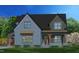 Two-story home with gray siding, brown accents, and a covered porch at 8717 Little Deer Ln, Raleigh, NC 27613
