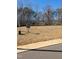 Image shows a vacant lot ready for building a home in a wooded and developed community at 8717 Little Deer Ln, Raleigh, NC 27613