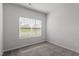 Simple bedroom with carpet, window, and neutral walls at 910 Rhino Bnd, Oxford, NC 27565