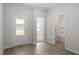 Bright foyer with wood-look floors, and access to a full bathroom at 910 Rhino Bnd, Oxford, NC 27565