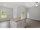 Spacious kitchen featuring a central island with granite countertop and ample cabinet space at 910 Rhino Bnd, Oxford, NC 27565