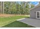 Concrete patio overlooking a wooded yard at 9164 Dupree Meadow Dr # 14, Angier, NC 27501