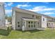 Spacious backyard featuring a concrete patio, lush lawn, and gray siding at 9164 Dupree Meadow Dr # 14, Angier, NC 27501