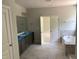 Bright bathroom featuring a double vanity and a soaking tub, creating a relaxing spa-like atmosphere at 9164 Dupree Meadow Dr # 14, Angier, NC 27501