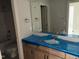 Bright bathroom with a large mirror above a light wood vanity and walk-in shower at 9164 Dupree Meadow Dr # 14, Angier, NC 27501