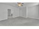 Large bedroom features neutral walls, plush carpeting, ceiling fan, and two entrances at 9164 Dupree Meadow Dr # 14, Angier, NC 27501