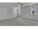 Large bedroom features neutral walls, plush carpeting, ceiling fan, and large window at 9164 Dupree Meadow Dr # 14, Angier, NC 27501