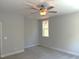 Neutral bedroom featuring a ceiling fan and window at 9164 Dupree Meadow Dr # 14, Angier, NC 27501