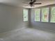 Empty bedroom featuring multiple windows offering natural light and views of the surrounding landscape at 9164 Dupree Meadow Dr # 14, Angier, NC 27501