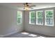 Bedroom featuring three large windows allowing lots of natural light at 9164 Dupree Meadow Dr # 14, Angier, NC 27501
