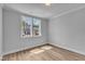 Bright bedroom featuring hardwood floors, crown molding, and a large window at 9164 Dupree Meadow Dr # 14, Angier, NC 27501