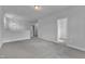 Open bonus room with neutral walls, plush carpeting, light fixture, and door leading to closet at 9164 Dupree Meadow Dr # 14, Angier, NC 27501