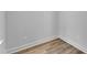 Corner of room features light wood flooring, clean white baseboards and neutral walls with electrical outlets at 9164 Dupree Meadow Dr # 14, Angier, NC 27501
