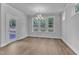 Bright dining room with modern chandelier, large windows, and view of back yard at 9164 Dupree Meadow Dr # 14, Angier, NC 27501
