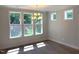 Dining room with a chandelier, hardwood floors and large windows offering natural light at 9164 Dupree Meadow Dr # 14, Angier, NC 27501