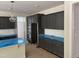Kitchen features dark cabinets, stainless steel appliances, and an island with space for seating at 9164 Dupree Meadow Dr # 14, Angier, NC 27501