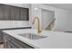 Kitchen island with stainless steel sink, quartz countertop and stylish gold faucet at 9164 Dupree Meadow Dr # 14, Angier, NC 27501