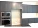 Modern kitchen featuring stainless steel appliances and gray cabinets at 9164 Dupree Meadow Dr # 14, Angier, NC 27501