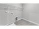 Utility room featuring tile floors, hookups, and a hanging shelf at 9164 Dupree Meadow Dr # 14, Angier, NC 27501