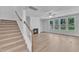 Inviting living room with fireplace, lots of light, and wood-look floors at 9164 Dupree Meadow Dr # 14, Angier, NC 27501