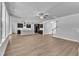 Open-concept living area with hardwood floors adjacent to modern kitchen at 9164 Dupree Meadow Dr # 14, Angier, NC 27501