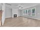 Spacious living room with fireplace, lots of natural light and wood-look flooring at 9164 Dupree Meadow Dr # 14, Angier, NC 27501