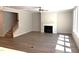 Open concept living room featuring a gas fireplace, hardwood floors, and natural light at 9164 Dupree Meadow Dr # 14, Angier, NC 27501