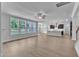 Open living room and kitchen area features wood-look floors and plenty of light at 9164 Dupree Meadow Dr # 14, Angier, NC 27501