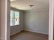 Empty room featuring crown molding and a window at 9164 Dupree Meadow Dr # 14, Angier, NC 27501