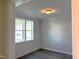 Bright room with two windows, hardwood floors, and neutral walls, perfect for an office or guest room at 9164 Dupree Meadow Dr # 14, Angier, NC 27501