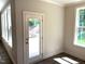 Bright room with a view to the backyard through a glass door and windows at 9164 Dupree Meadow Dr # 14, Angier, NC 27501