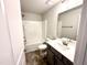 Bathroom featuring a shower-tub combo and single vanity sink at 111 Southern Estates Dr, Sanford, NC 27330