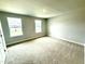 Large bedroom with carpet flooring and windows at 111 Southern Estates Dr, Sanford, NC 27330