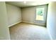 Carpeted bedroom with one window at 111 Southern Estates Dr, Sanford, NC 27330