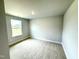 Bedroom with carpet flooring and one window at 111 Southern Estates Dr, Sanford, NC 27330