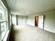 Bedroom with carpet, two windows, and fresh paint throughout at 111 Southern Estates Dr, Sanford, NC 27330