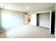 Bedroom with neutral carpeting, fresh paint, and adjacent room at 111 Southern Estates Dr, Sanford, NC 27330