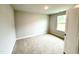 Modest bedroom featuring carpet floors, natural light, and neutral paint at 111 Southern Estates Dr, Sanford, NC 27330