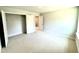 Bedroom showcasing plush carpet, neutral walls and a closet, with a doorway to the hall at 111 Southern Estates Dr, Sanford, NC 27330
