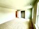 Large bedroom with carpet flooring and a closet at 111 Southern Estates Dr, Sanford, NC 27330