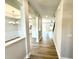 Inviting foyer featuring light wood floors and an open view to the dining room and living area at 111 Southern Estates Dr, Sanford, NC 27330