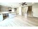 Modern kitchen with gray cabinets, quartz countertops, stainless steel appliances, and wood flooring at 111 Southern Estates Dr, Sanford, NC 27330