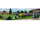 People are enjoying the town common with a stage for performances in the background at 111 Southern Estates Dr, Sanford, NC 27330