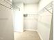 Walk-in closet featuring wire shelving and carpet at 111 Southern Estates Dr, Sanford, NC 27330